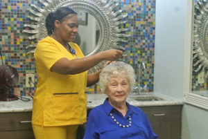 resident getting her hair done at the salon